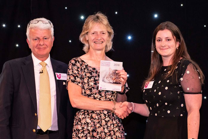 Photo: Sarah Hayward receiving her award from Erin Biss of Royal Canin (right) and iCatCare Chairman Stuart Carmichael (left)